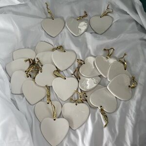 22 3.5” ceramic hearts ornaments/gold ties. 4 with slight blemish, see pics. K.